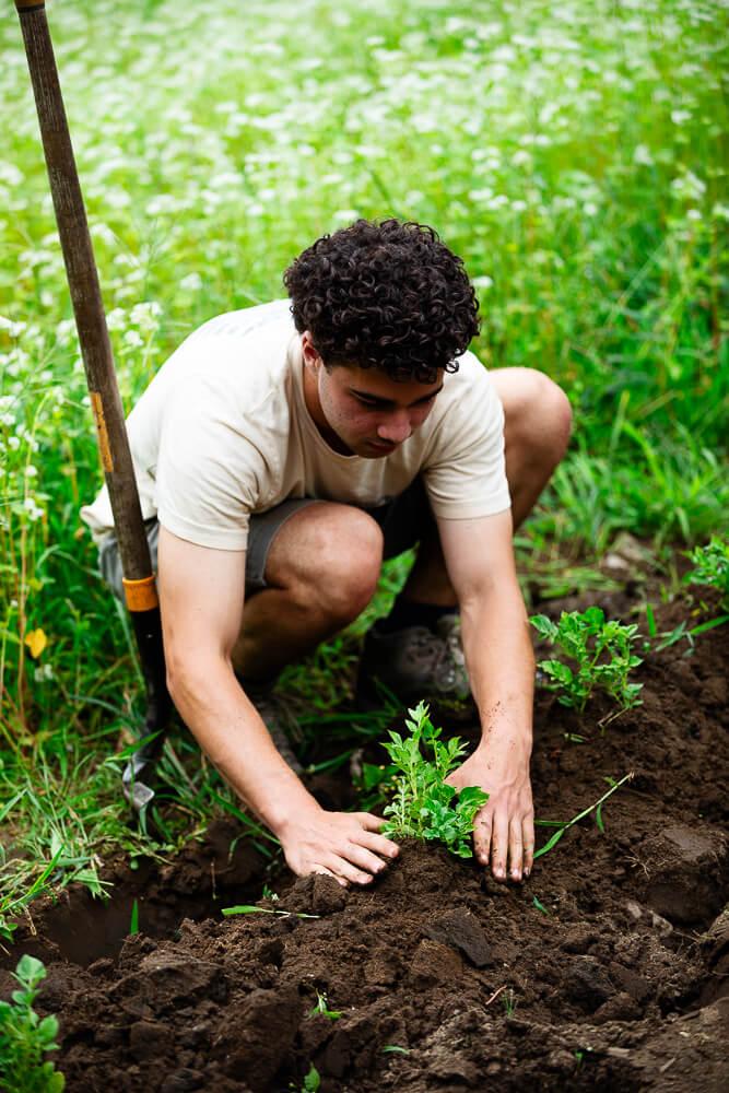 Student working in the dirt
