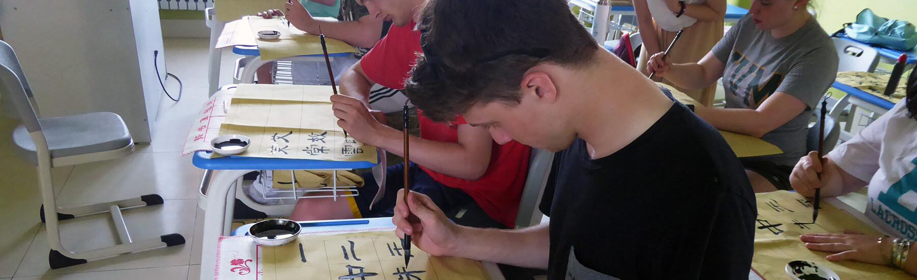 Students practicing writing Chinese letter