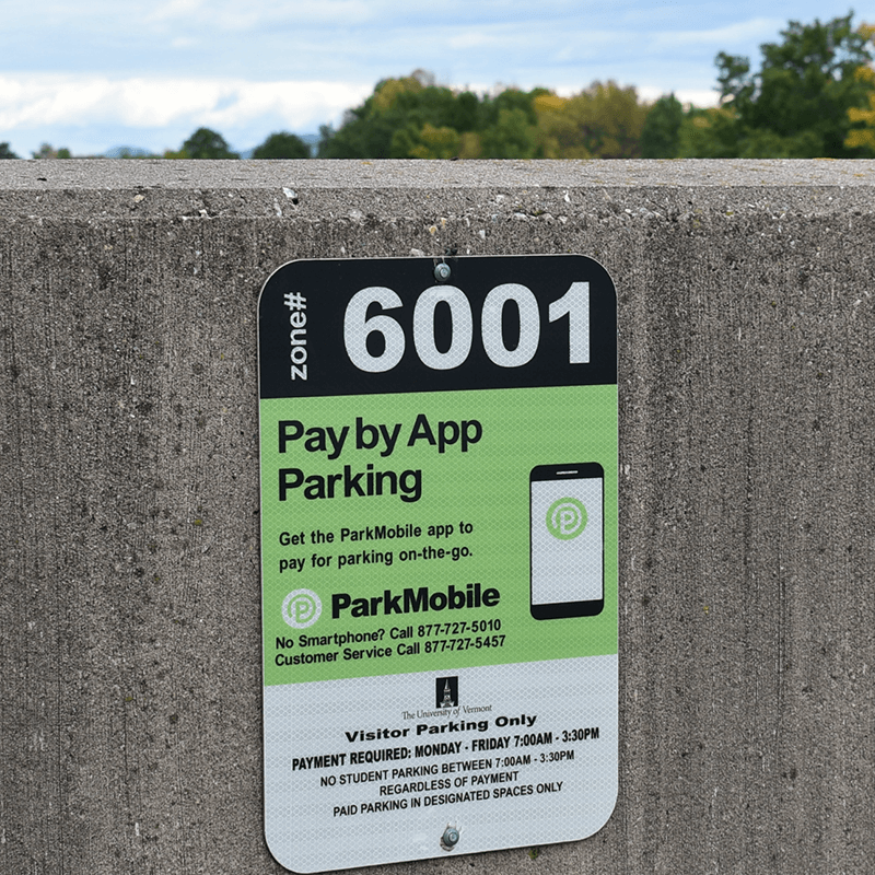 A parking sign on the top deck of Gutterson Garage indicating that students may not use this space regardless of payment.