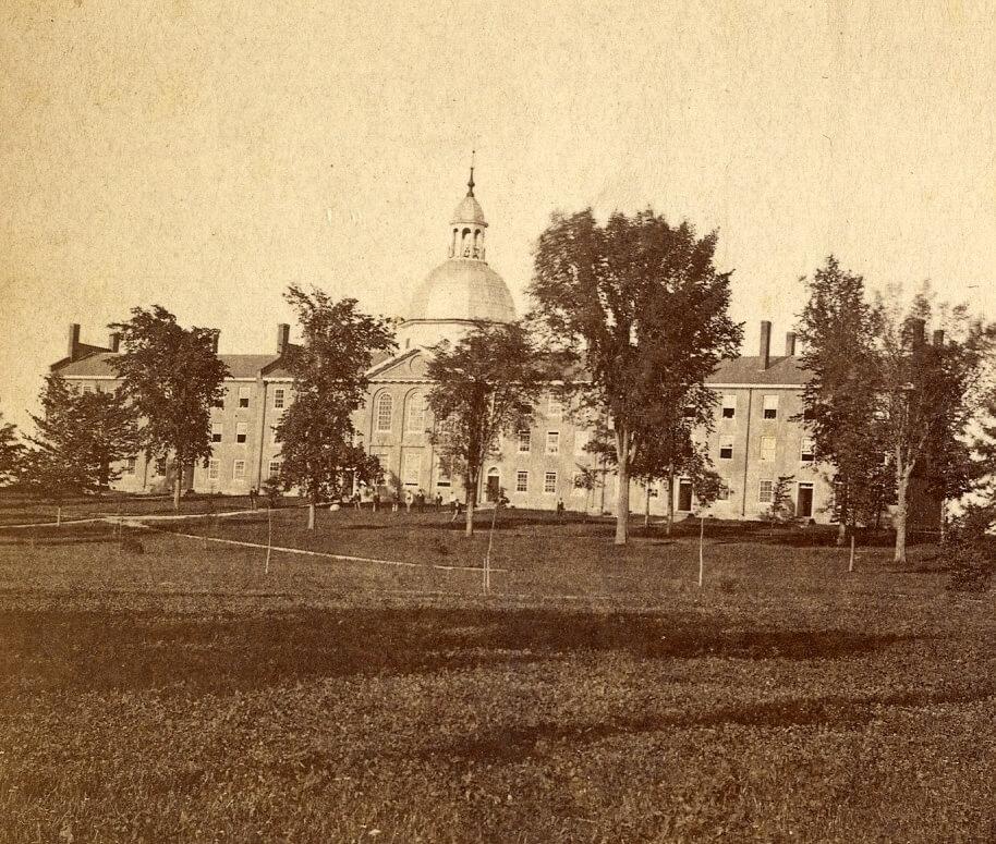 Historic picture of campus green and buildings.