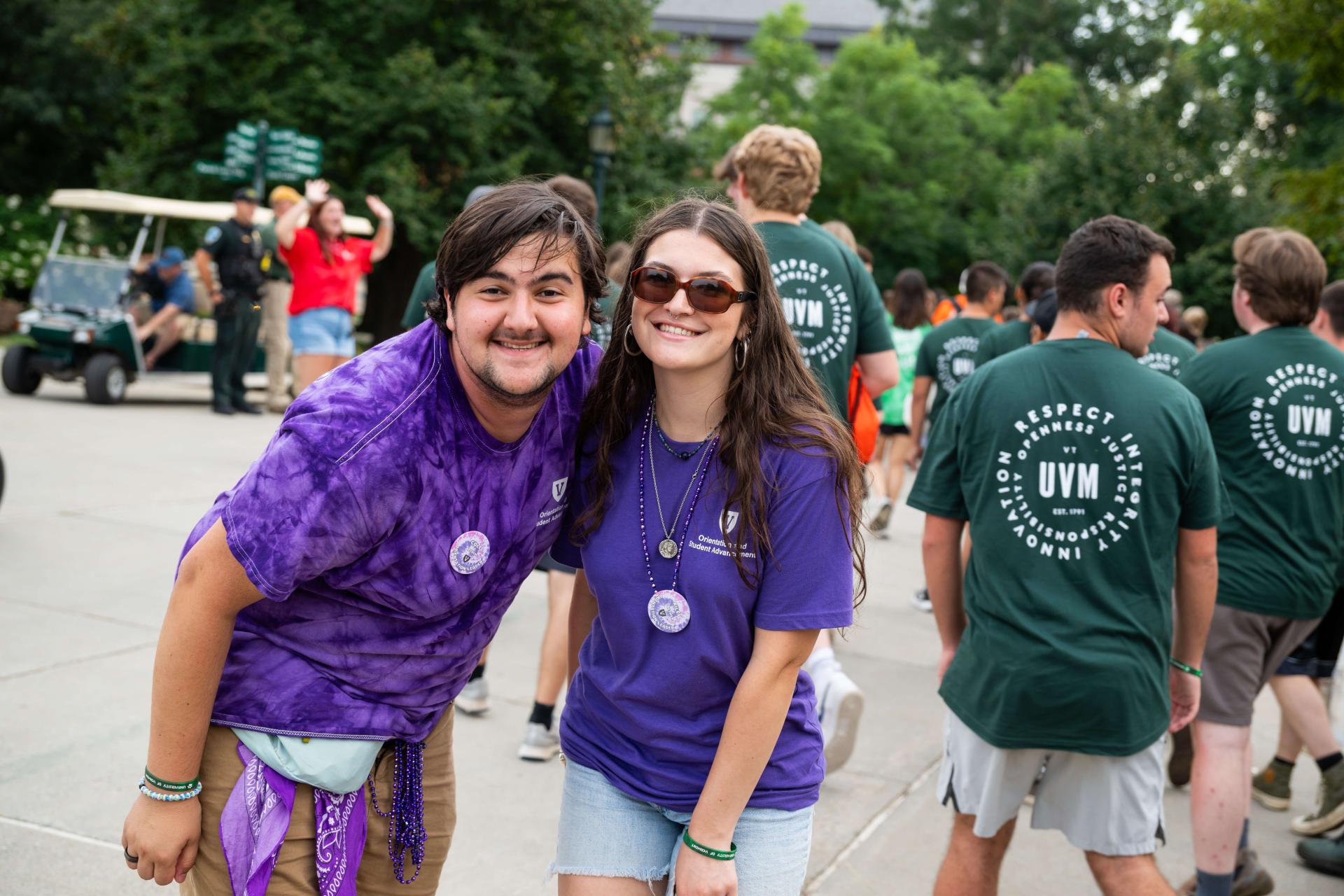 Two individuals smiling