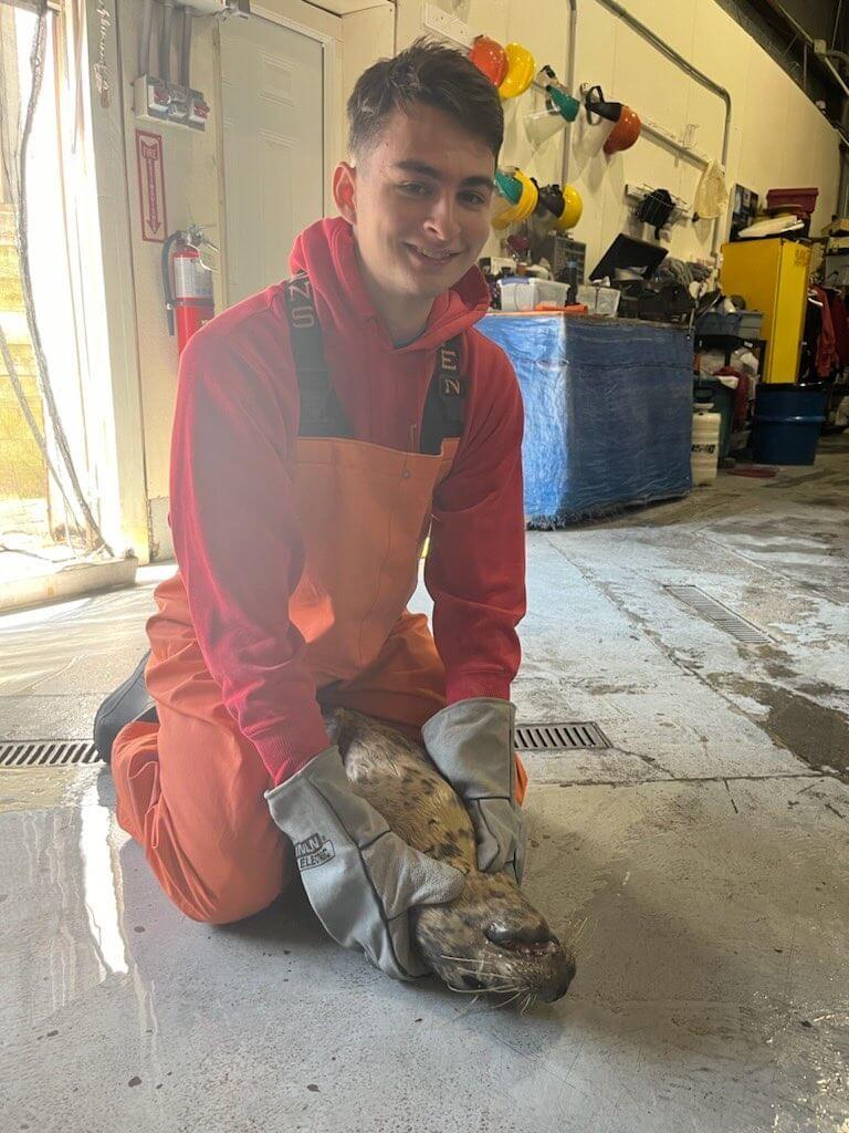 student holding seal