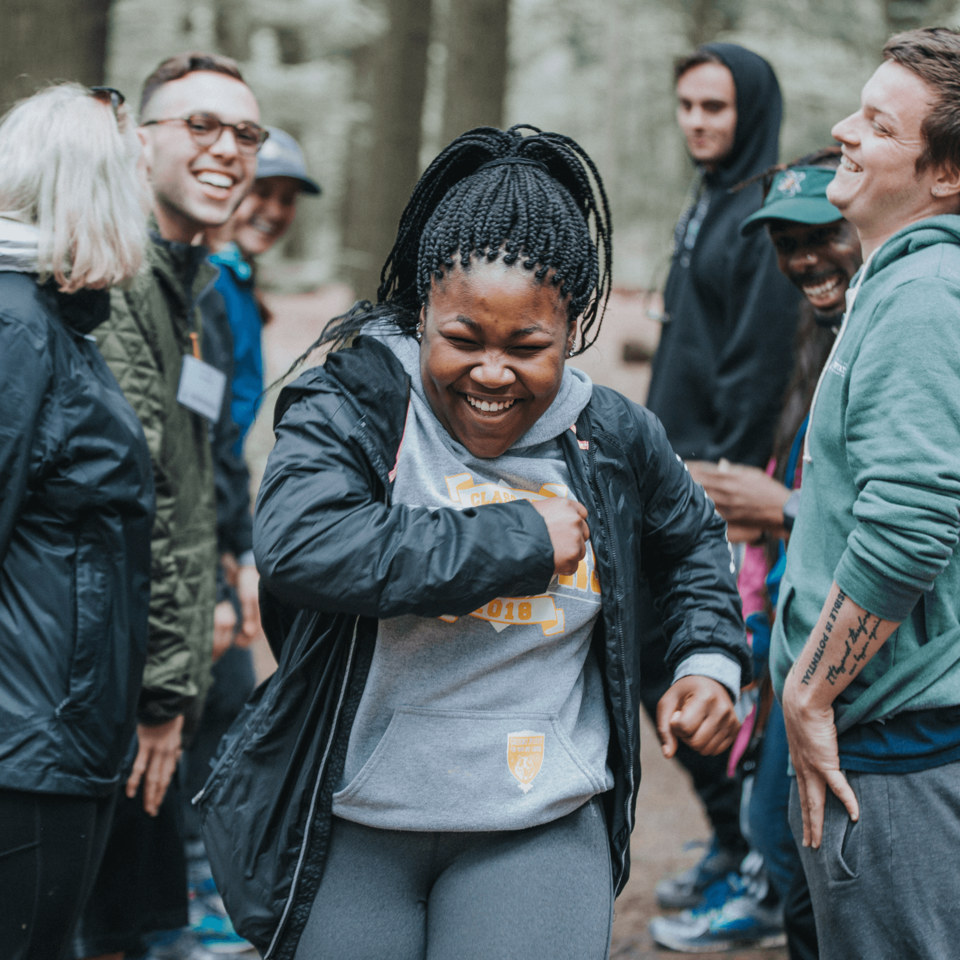 student participates in team building outdoors