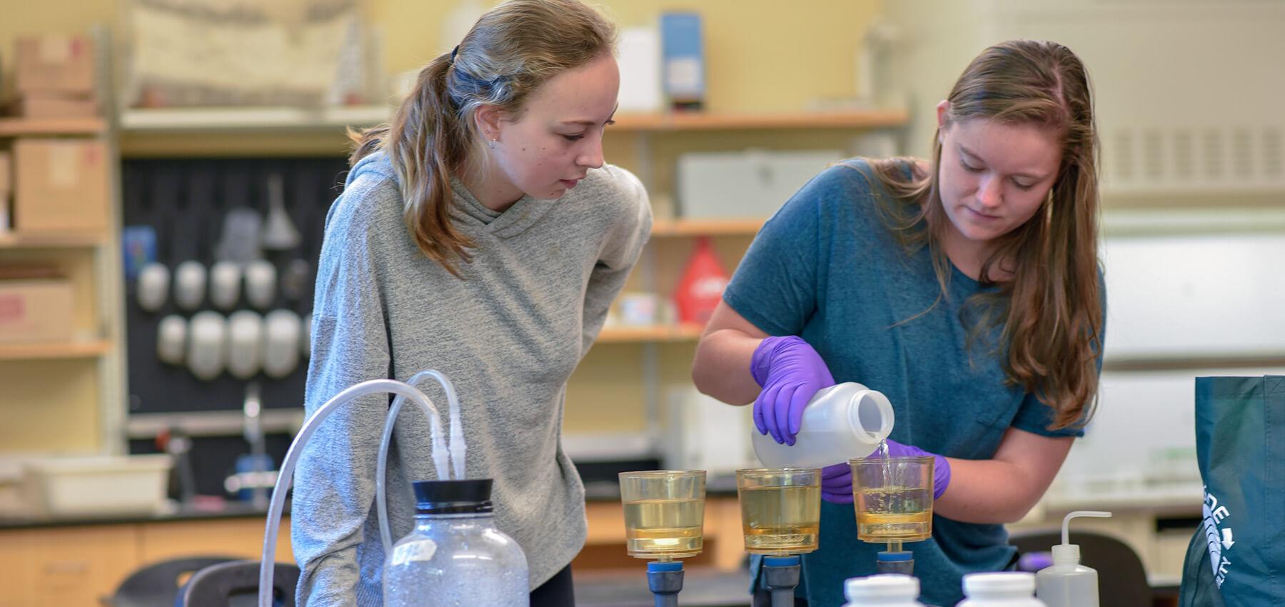Two students working in a lab