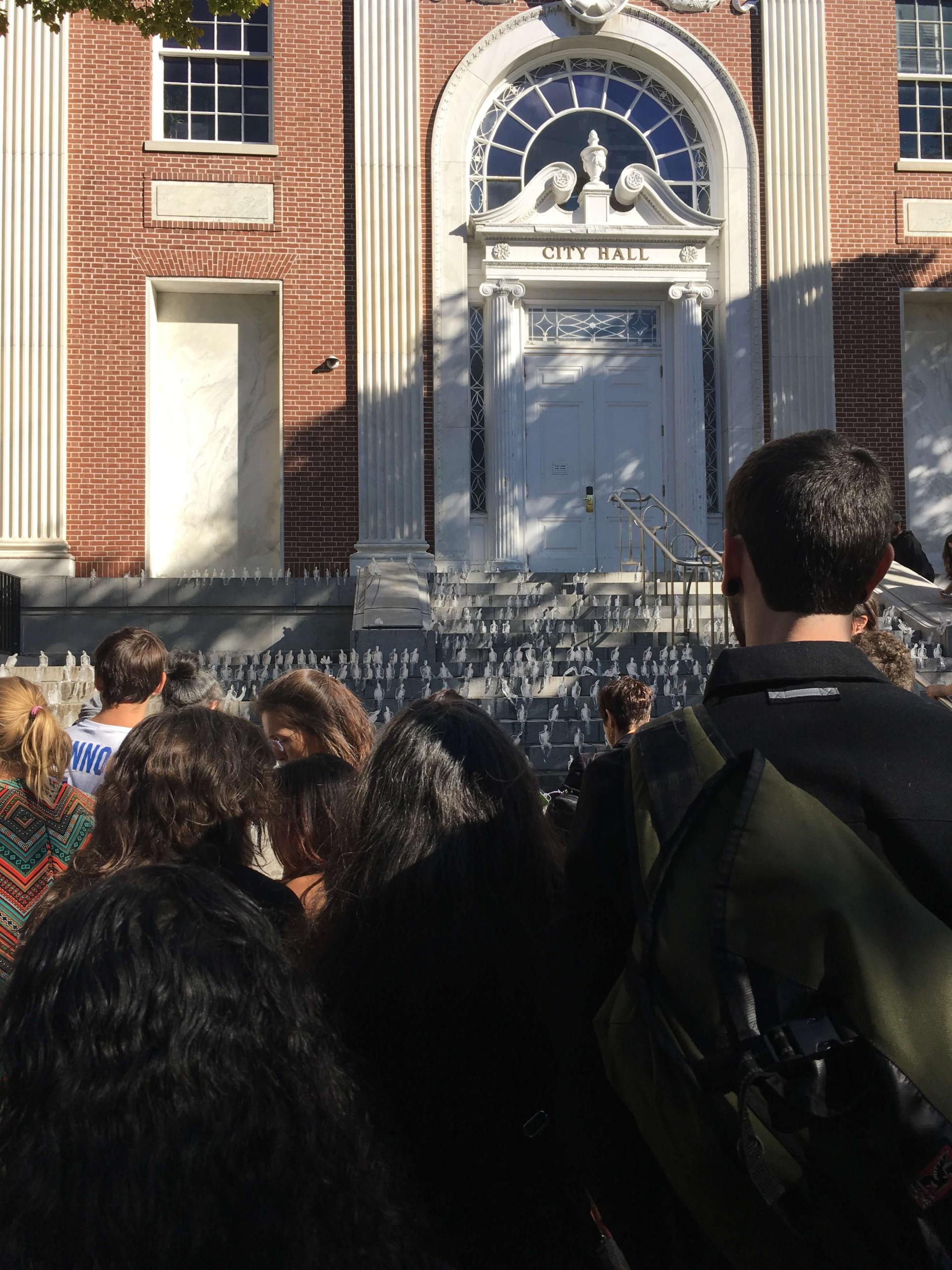 Group of people watching ice sculpture