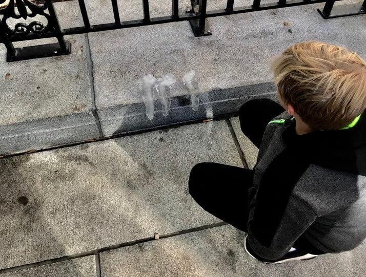 Kid watching ice sculpture