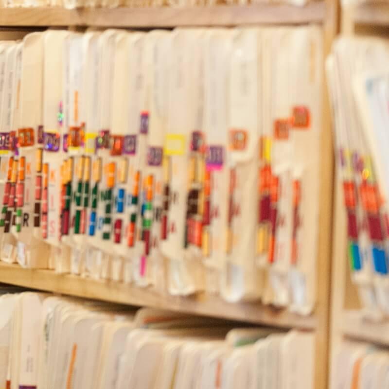 closeup of stacks of patient files