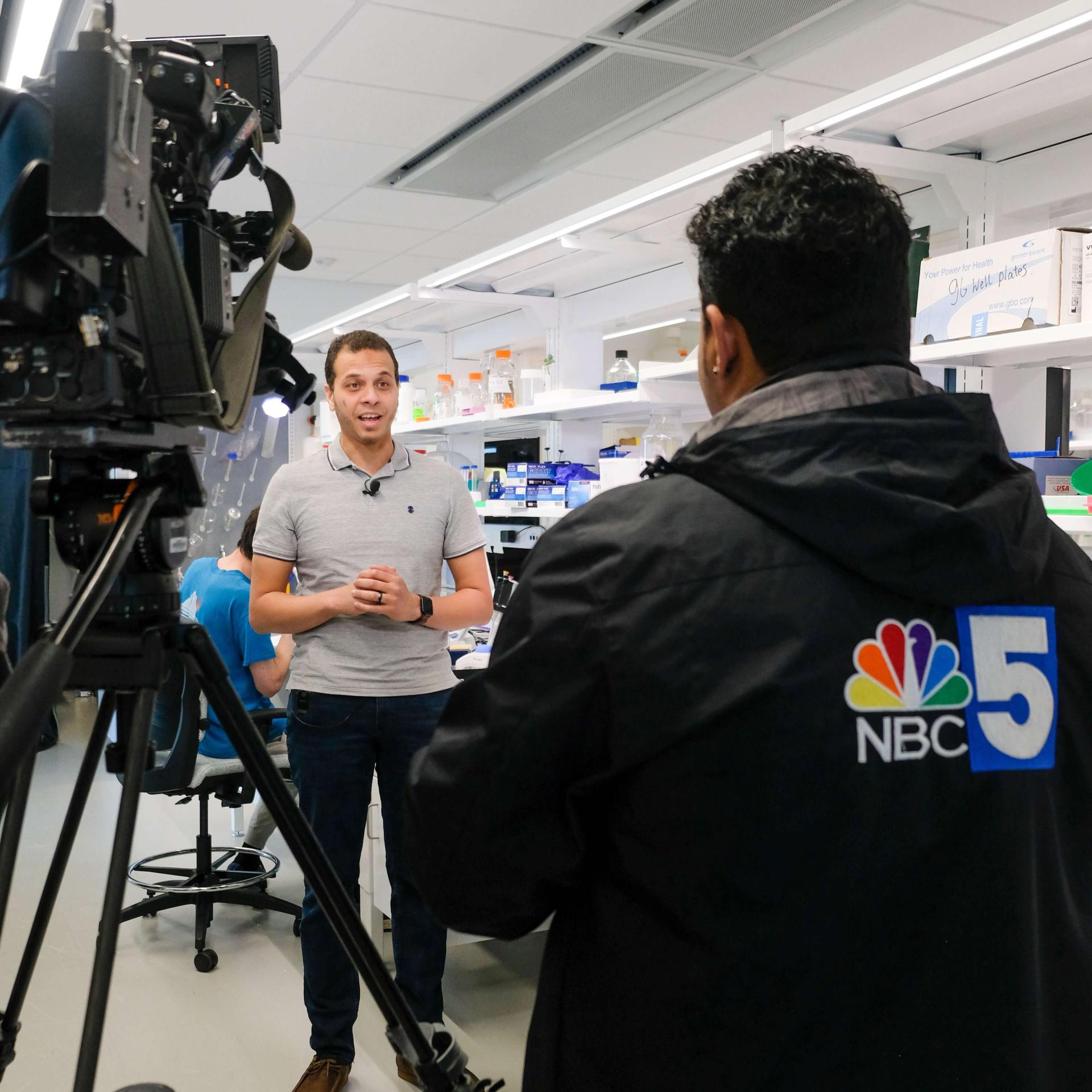 Image captured during a news interview with a researcher inside.