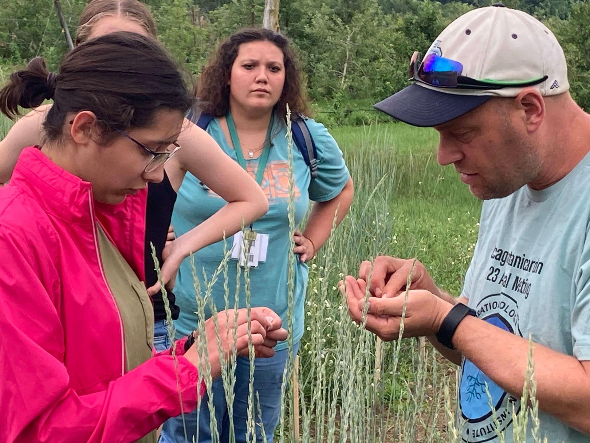 Faculty with students in the field