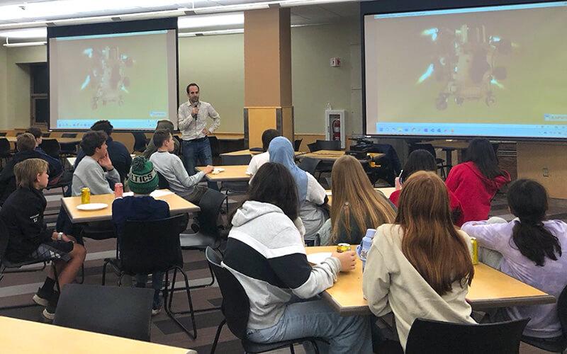 Professor Hamid Ossareh speaks to students during a Teen Science Café