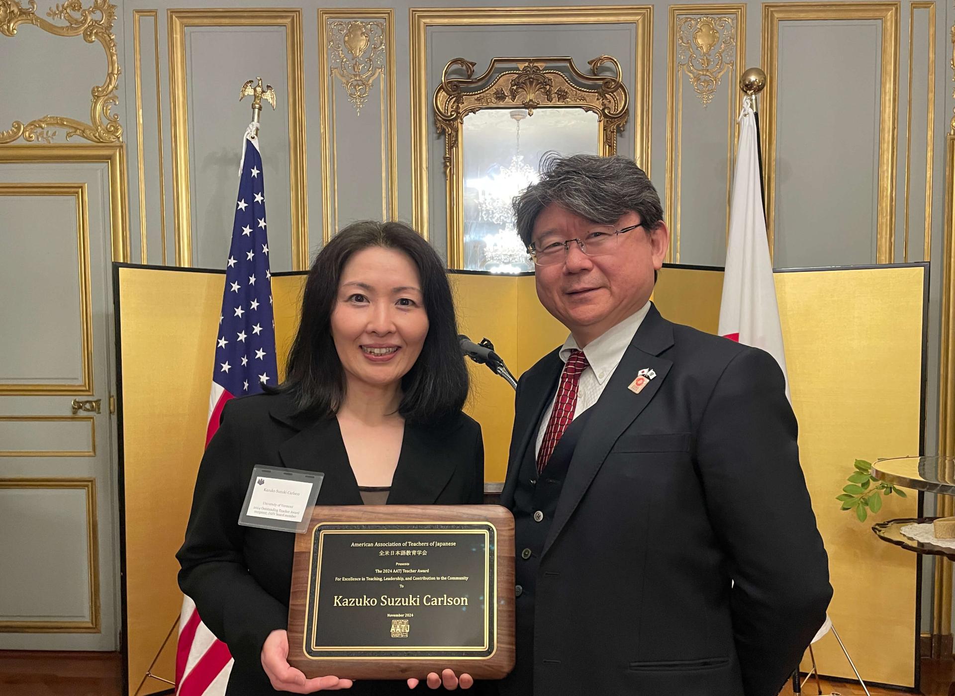 Prof Kazuko holding a award with General Takahashi