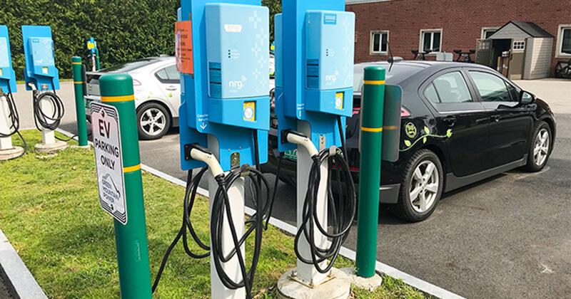 EVs plugged into a charging station