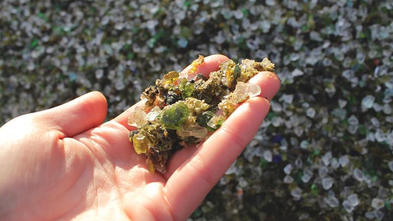 Hand displaying roadway aggregate sample