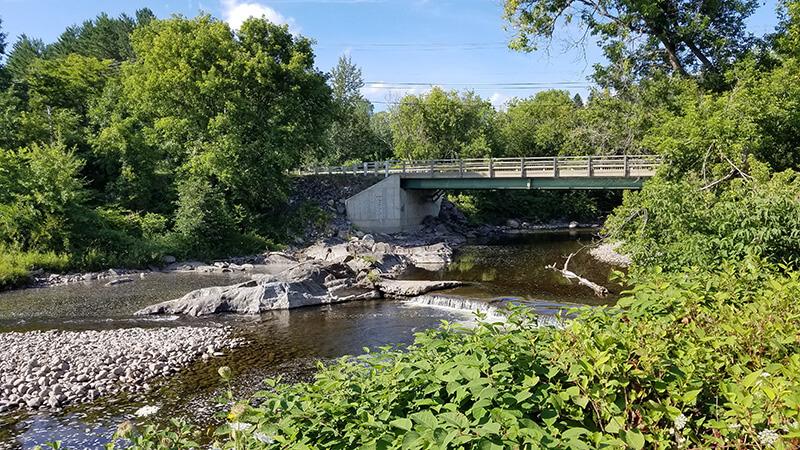 A bridge crossing a stream in rural Vermont