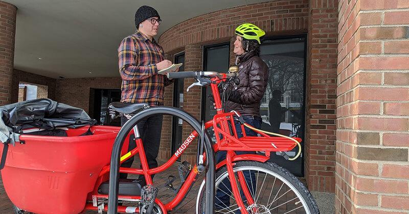 Researcher conducts an interview with a cyclist