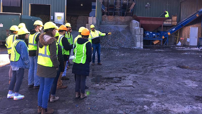UVM Engineering students from Professor Dewoolkar's class tour a Chittenden Solid Waste District material recovery facility
