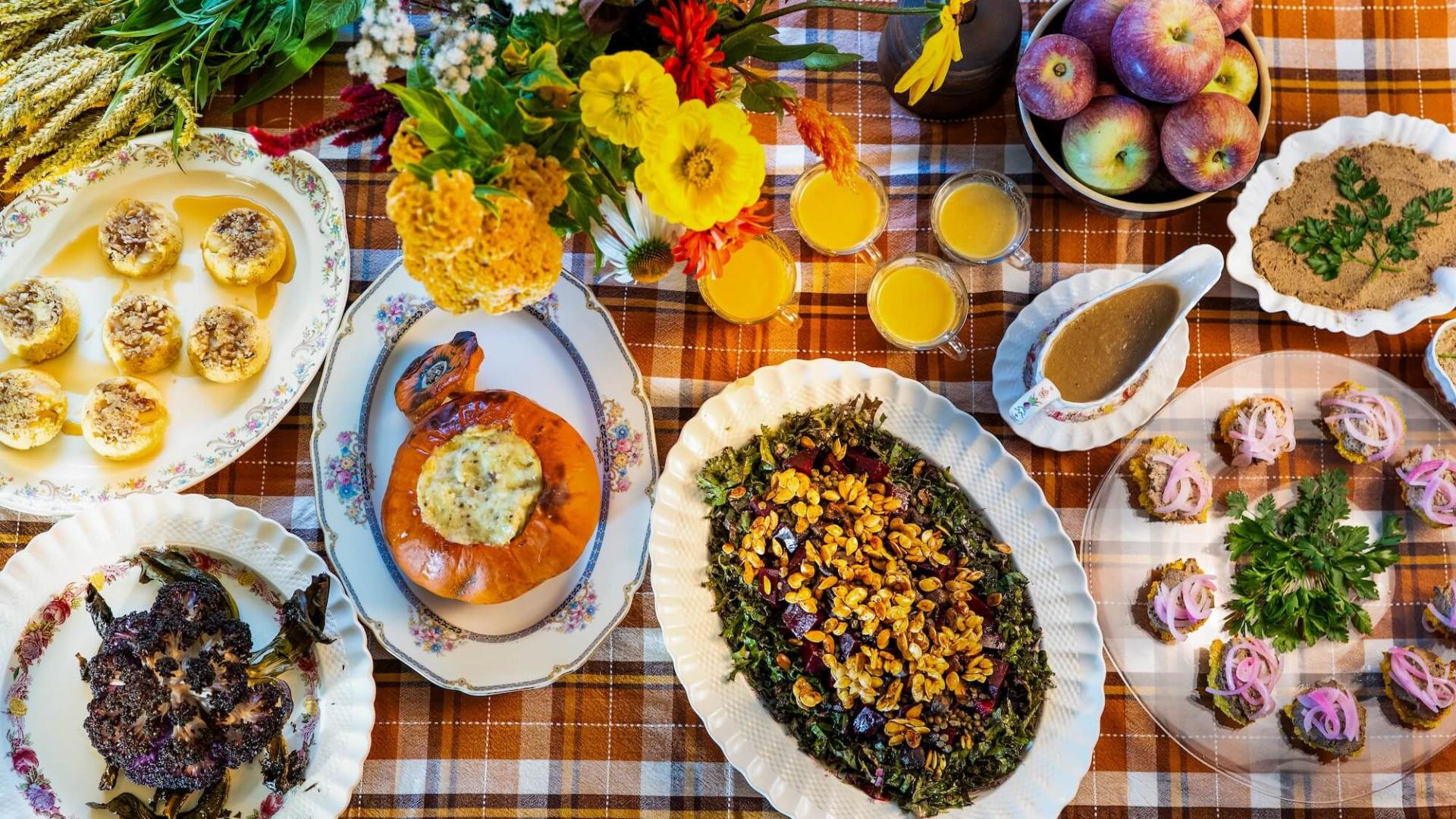 A table covered with tasty-looking dishes.