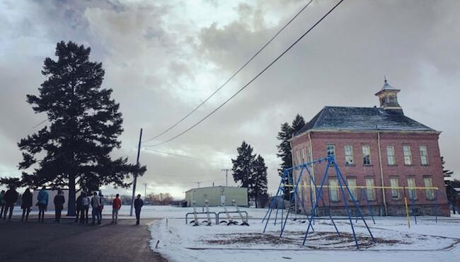 a brick Vermont schoolhouse on a snowy day