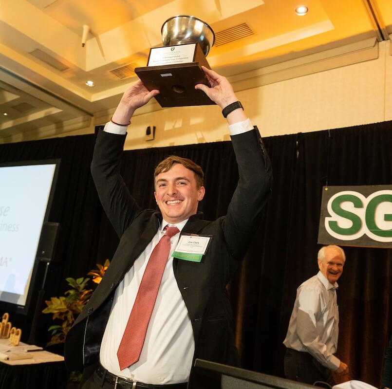 A winner of the 12th SG-FECC raises the trophy high