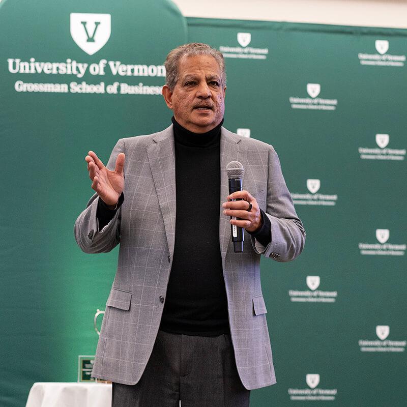Dean Sharma greets the audience at the 8th Annual Grossman Dean's Cup