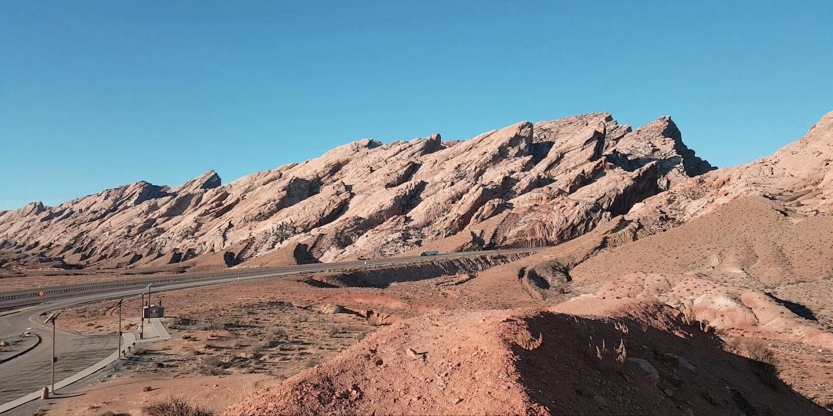 Image of red desert rocks in slanting formation
