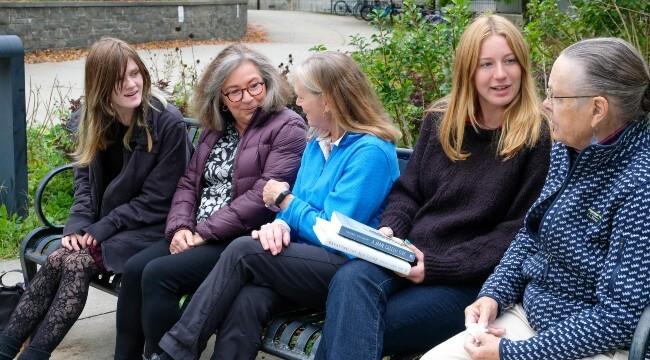 Faculty and students talking
