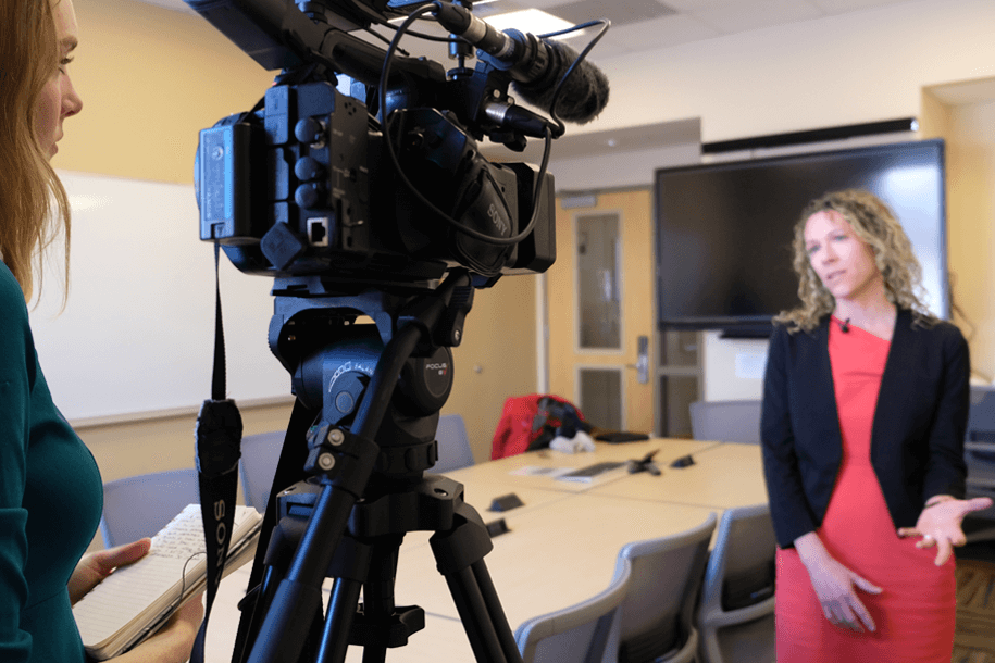 a woman filming a woman