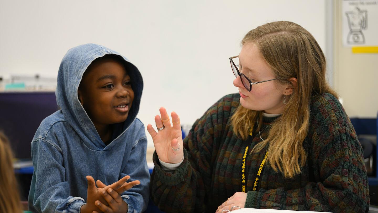 Charlie Meecham teaching a student during her internship at Allen Brook School..