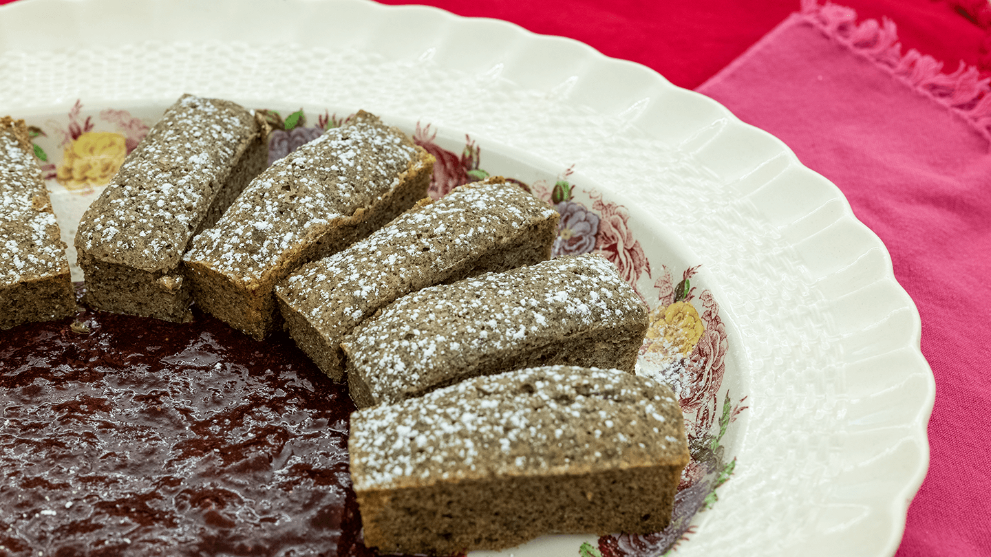 Financiers on a plate with strawberry compote