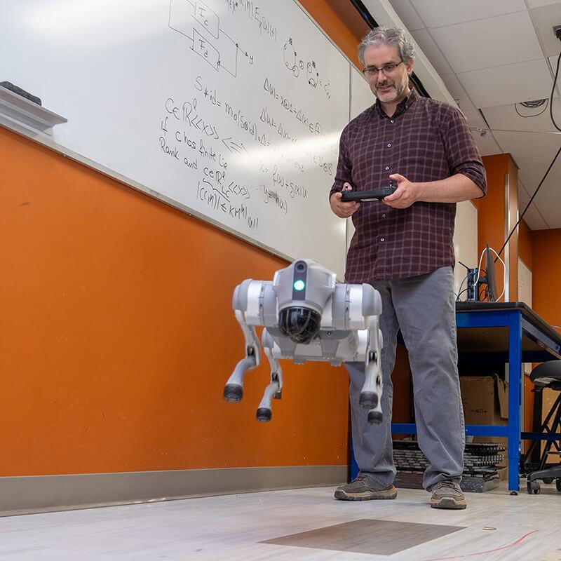 Associate Professor Luis Default Espinosa in his robotics lab