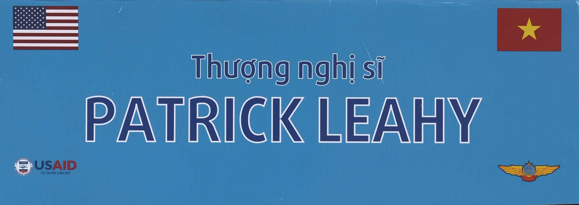 A blue name tag that says Patrick Leahy. His name is also listed in Vietnamese above the english.