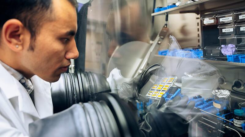 Researcher in physics lab
