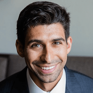Headshot of researcher smiling indoors.