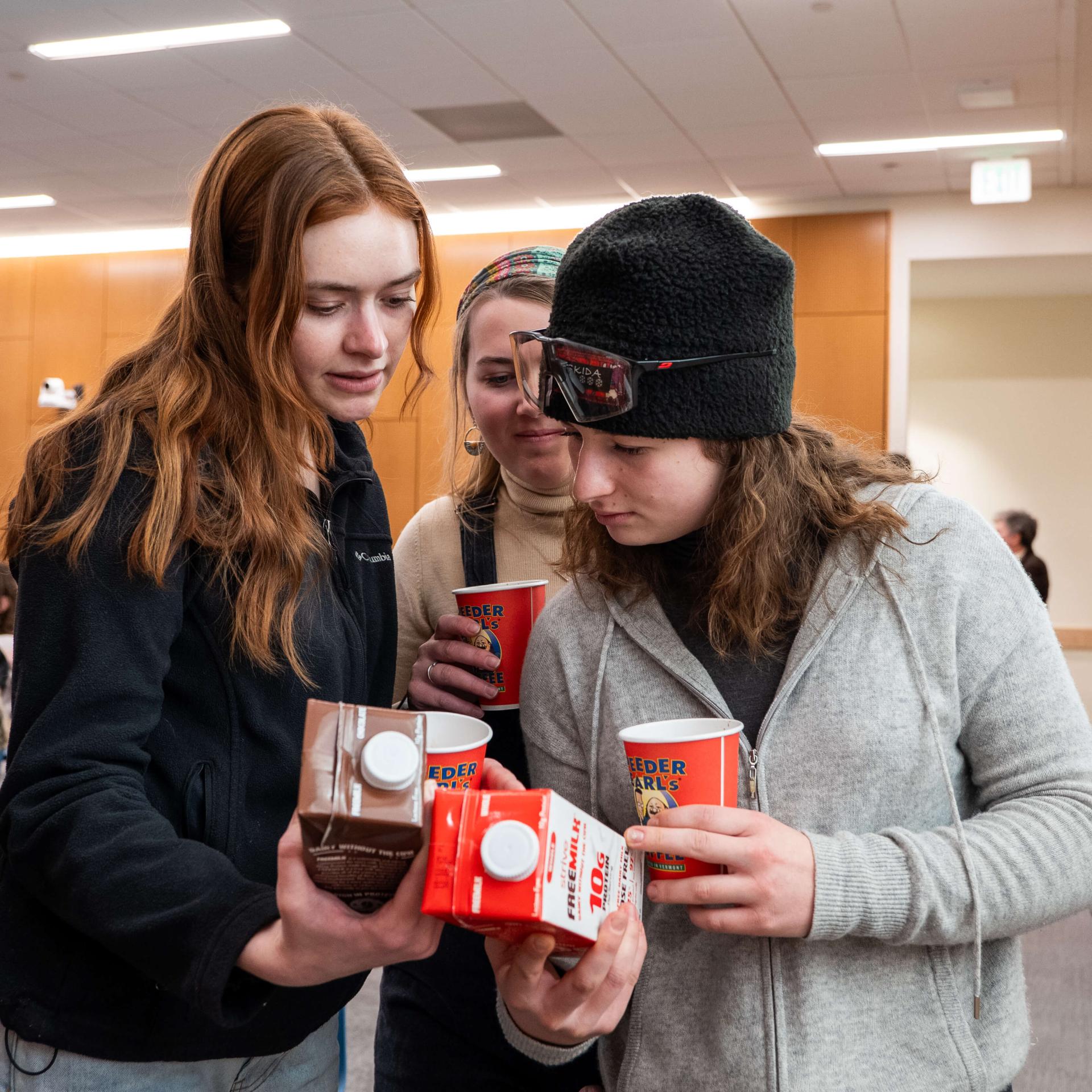 students looking at milk carton