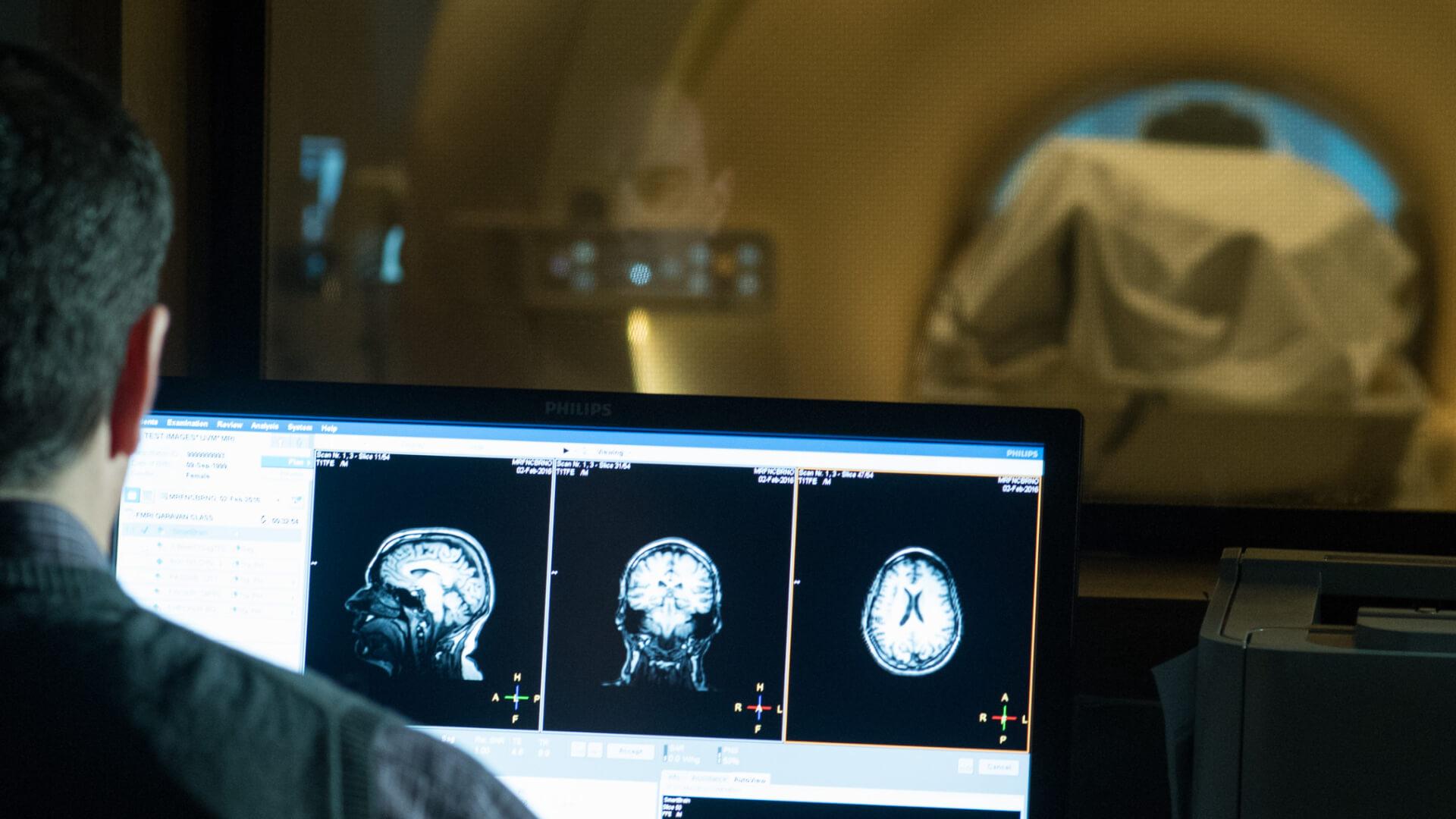 researcher looking at imaging results