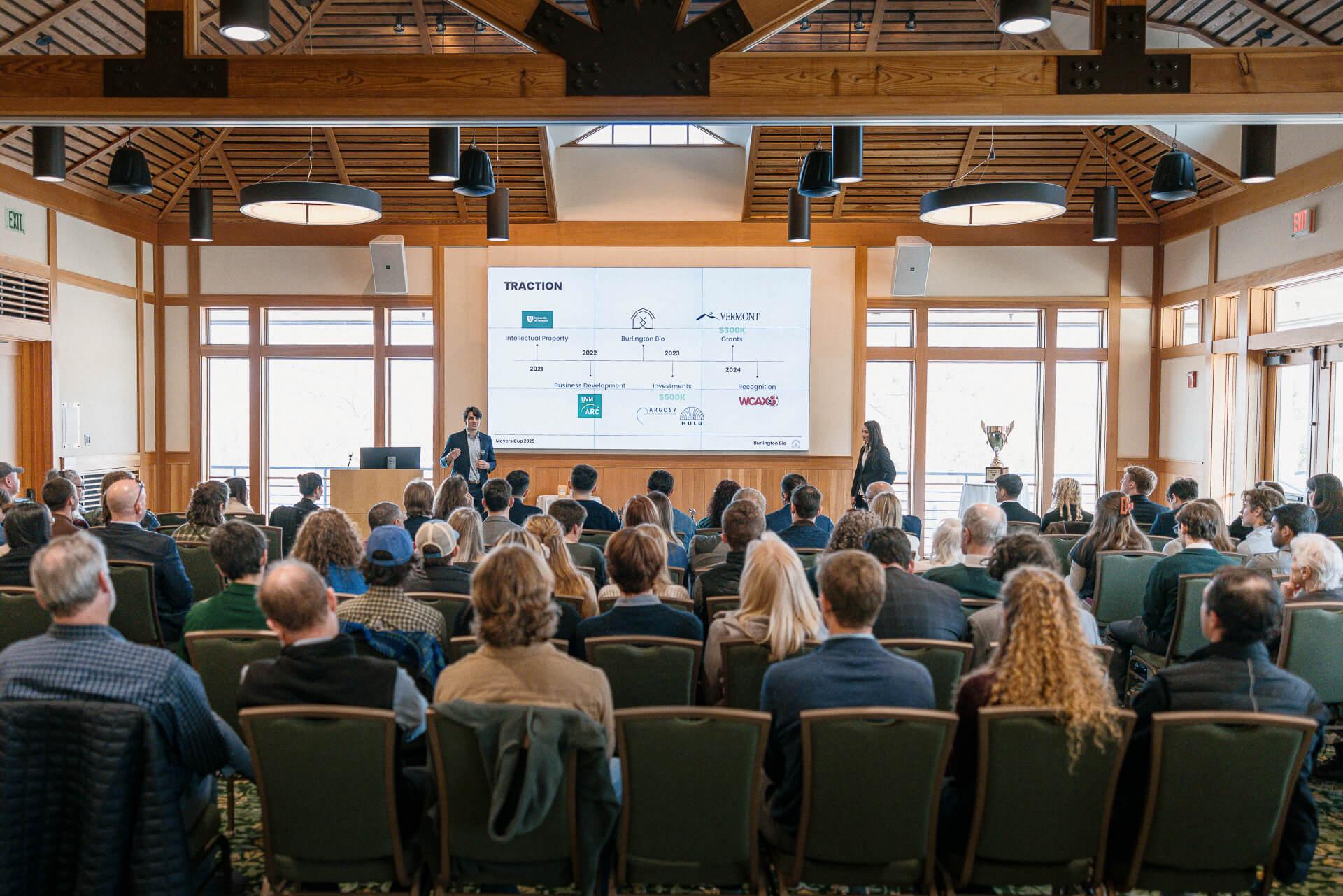 Mason Tuff and Julia Fitzgerald deliver their pitch to the judges' panel and a large audience