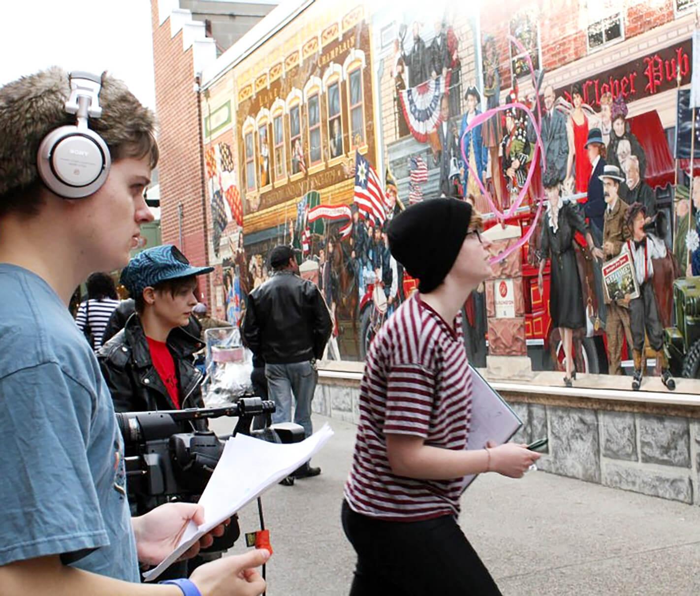Group of people holding script and shooting a film