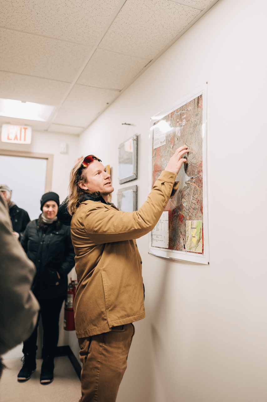 Man at a map explaining