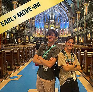 two male students smiling in a montreal cathedral