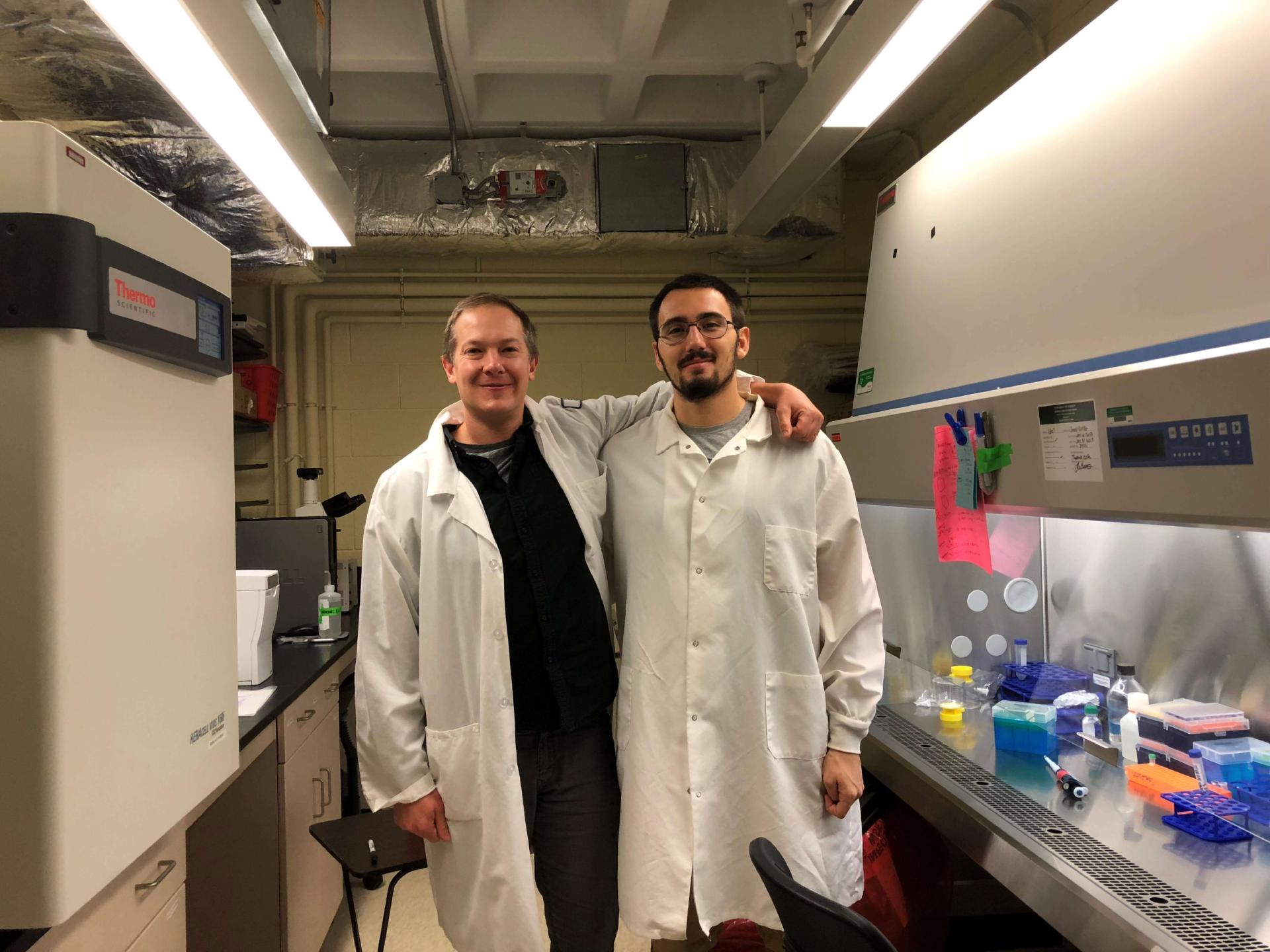 International scholar in research lab with colleague