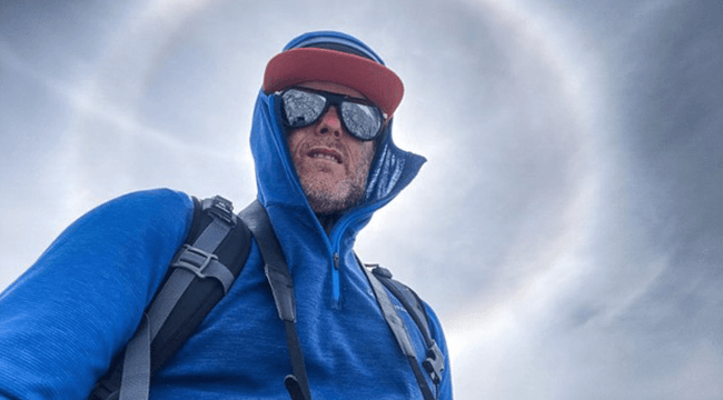 a man against a bright sunny winter background