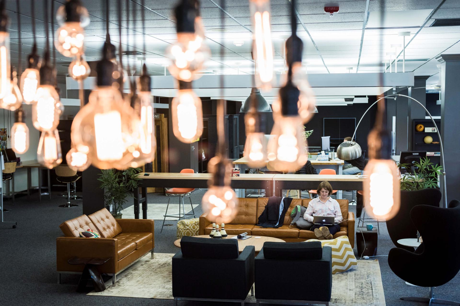 Close-up of light bulbs in a modern office space