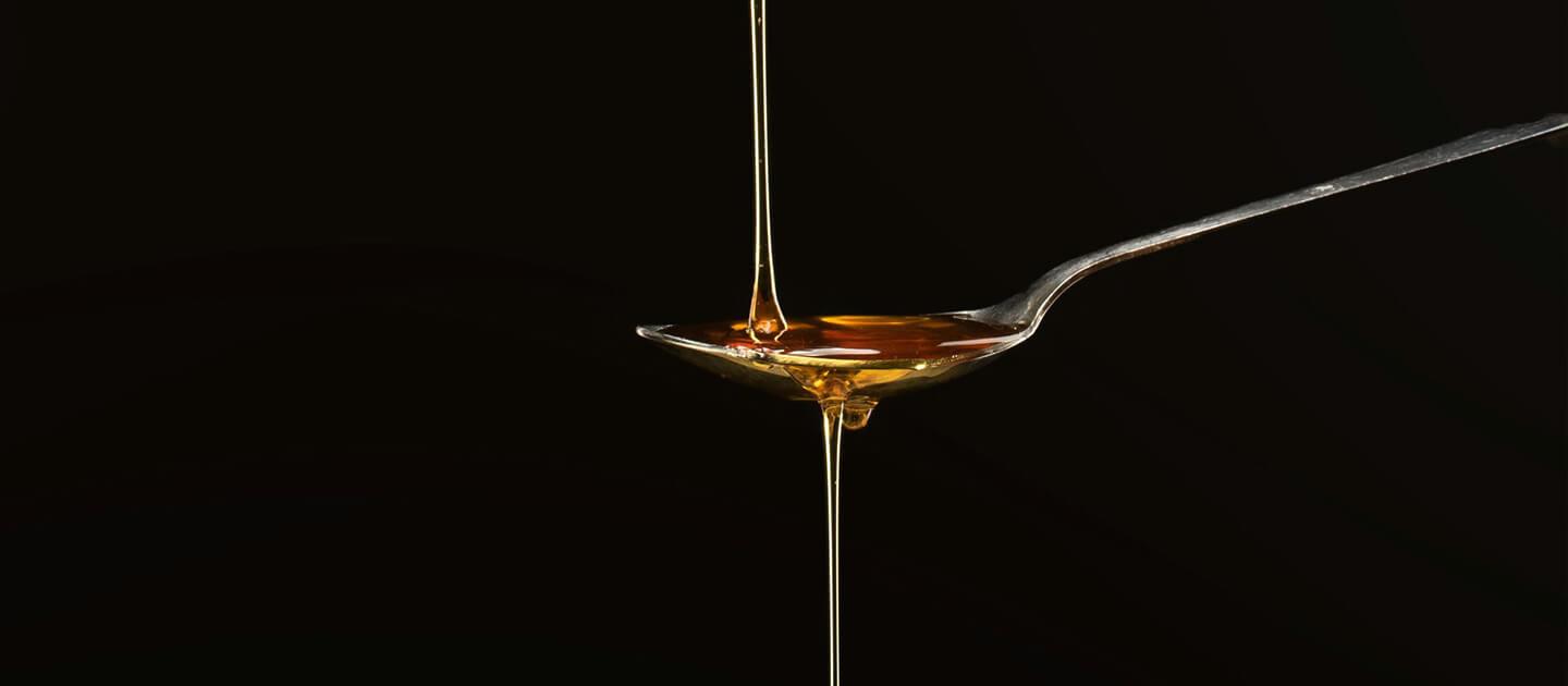 syrup dripping onto a spoon