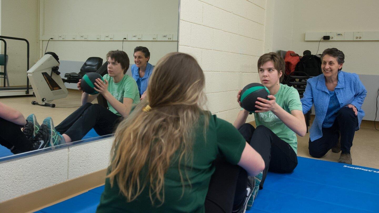 Dr. Sue Kasser with UVM student and participant in UVM's Unified Fitness program