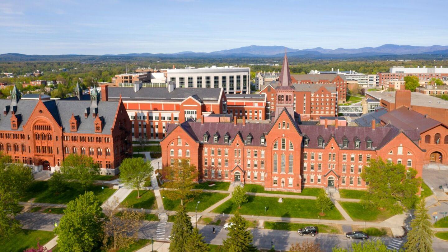 Drone view of UVM campus, UVM Medical Center, and mountains