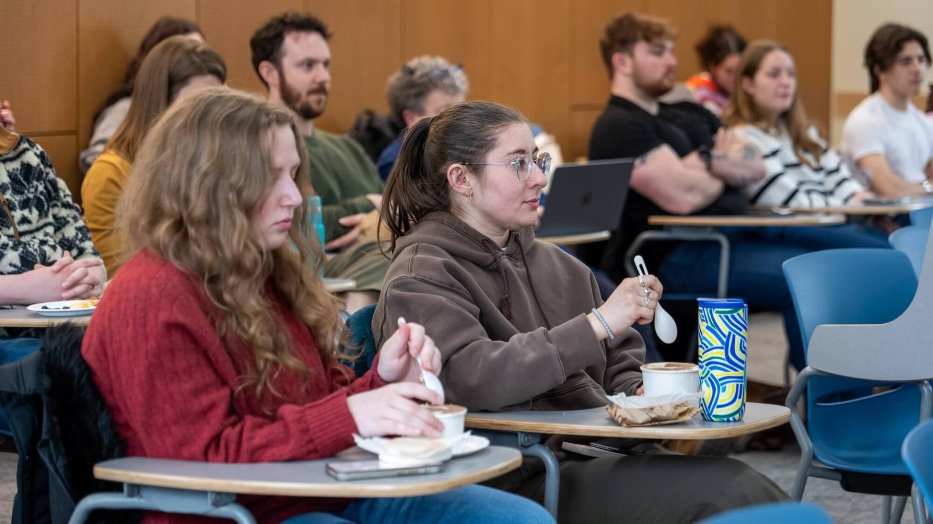 Students listen while sampling ice cream