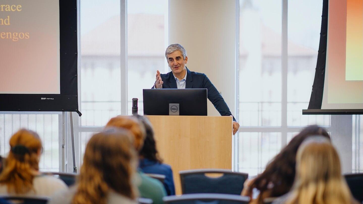 Miro Weinberger addresses students from podium