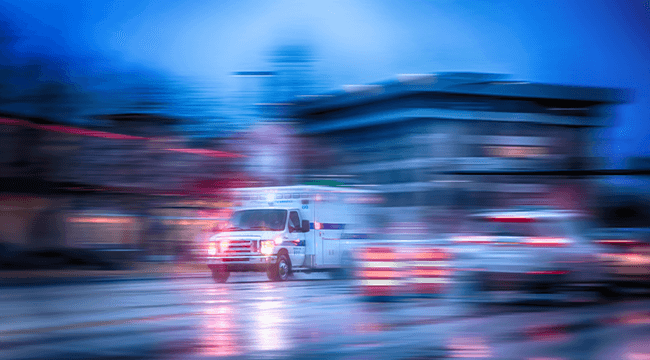 an ambulance speeding through a city