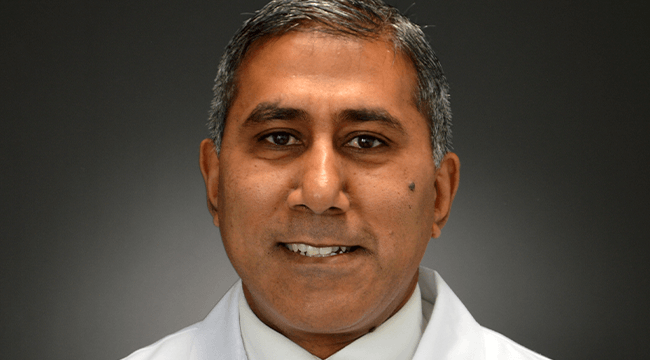 a man in a white coat