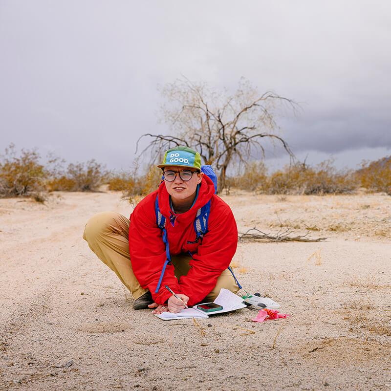 research student wearing hat that reads do good